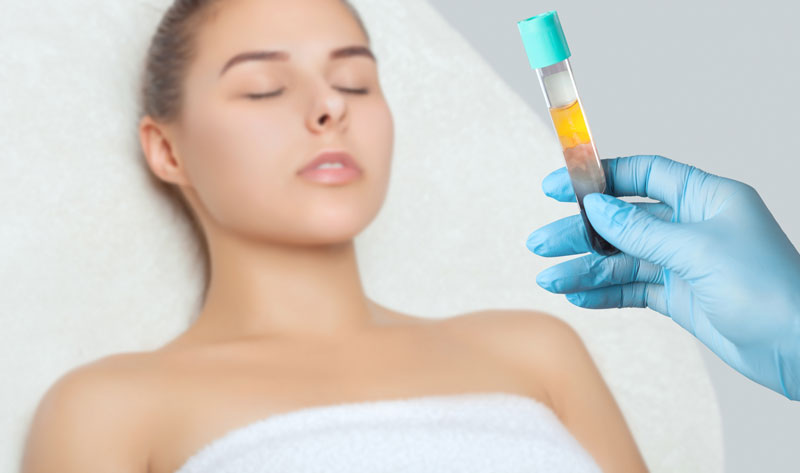 Cosmetologist does PRP therapy on the face of a beautiful woman